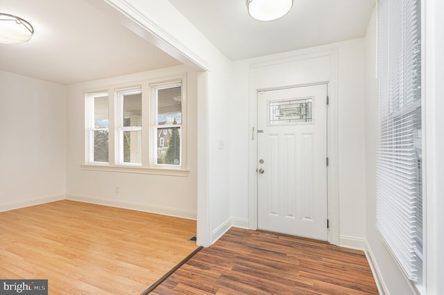 foyer entrance with hardwood / wood-style floors