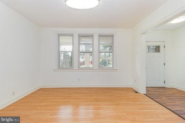 unfurnished room featuring light hardwood / wood-style flooring