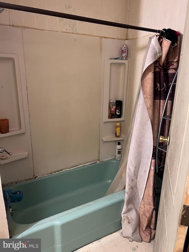 bathroom featuring shower / bath combination with curtain and tile patterned floors