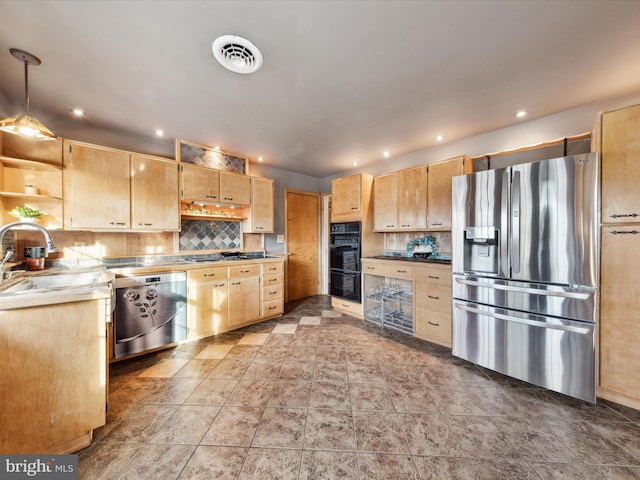 kitchen featuring sink, decorative light fixtures, light brown cabinets, decorative backsplash, and black appliances