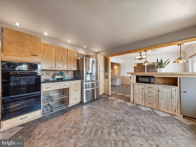 kitchen with hanging light fixtures and black appliances