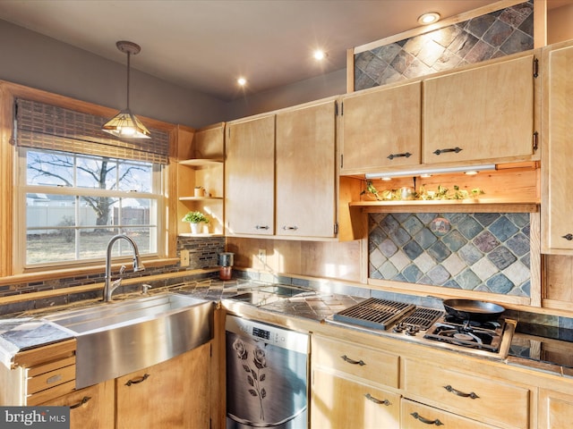 kitchen featuring decorative light fixtures, tasteful backsplash, sink, dishwashing machine, and light brown cabinets