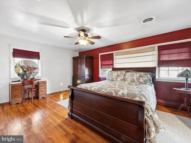 bedroom with hardwood / wood-style flooring and ceiling fan