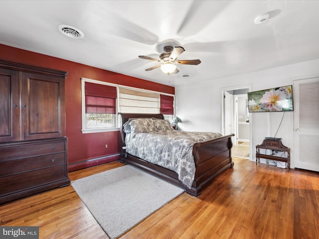 bedroom with wood-type flooring and ceiling fan