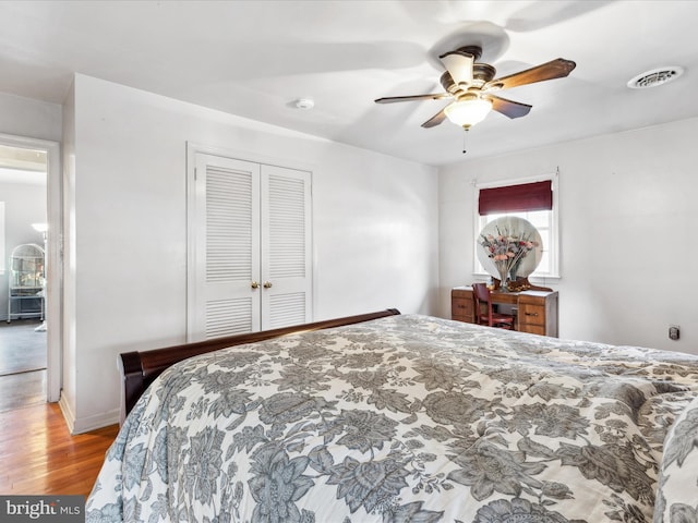 bedroom featuring a closet, ceiling fan, and light hardwood / wood-style flooring