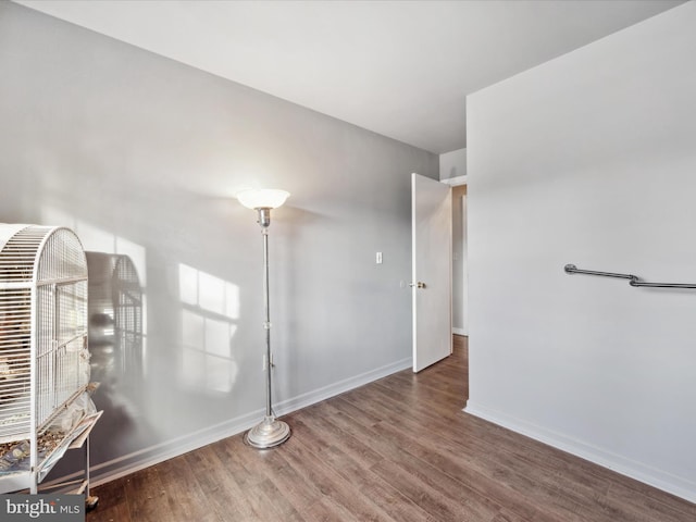 spare room featuring dark hardwood / wood-style floors