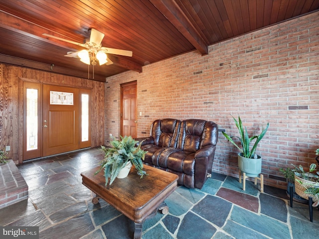 living room with brick wall and wooden ceiling