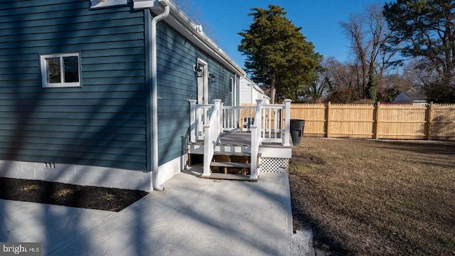 view of property exterior featuring a yard and a patio area