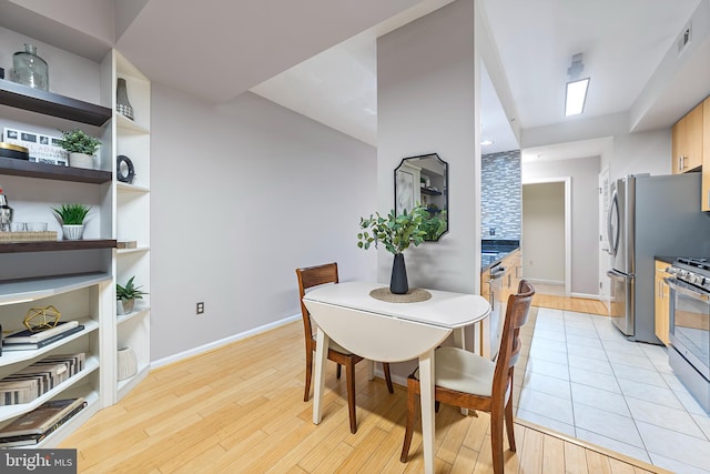 dining room featuring light hardwood / wood-style flooring