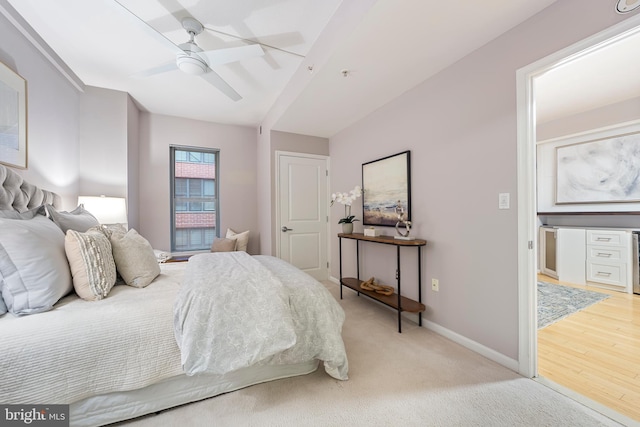 bedroom with light colored carpet and ceiling fan