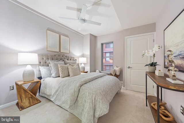 bedroom featuring light colored carpet and ceiling fan