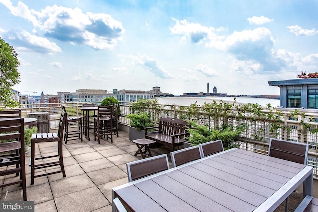 view of patio with a water view