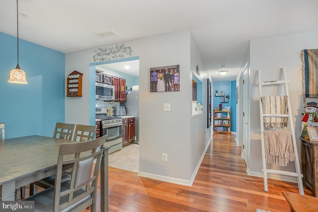 dining space featuring hardwood / wood-style floors