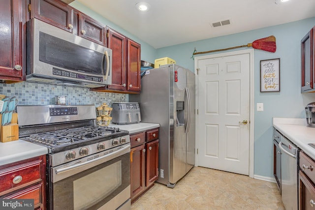 kitchen featuring tasteful backsplash and stainless steel appliances