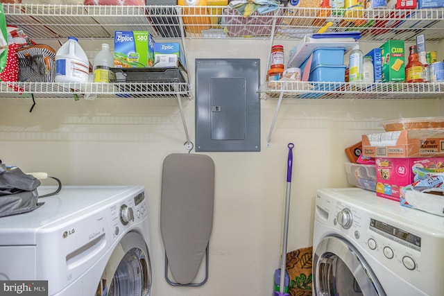 laundry room with separate washer and dryer and electric panel