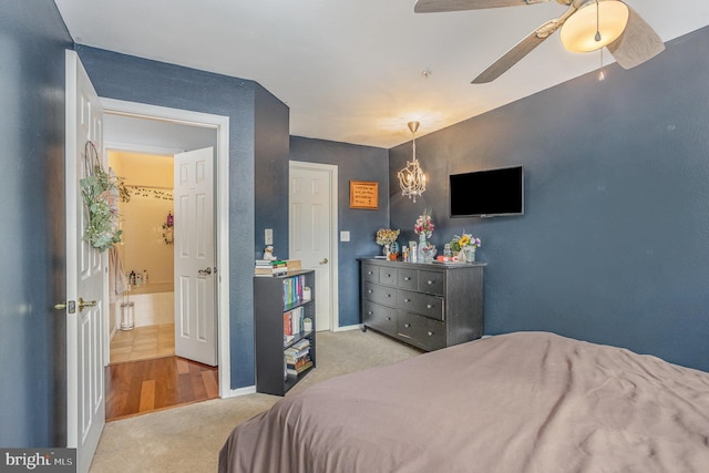 carpeted bedroom with ceiling fan