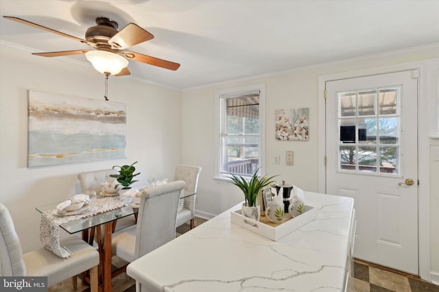 dining room featuring crown molding and ceiling fan