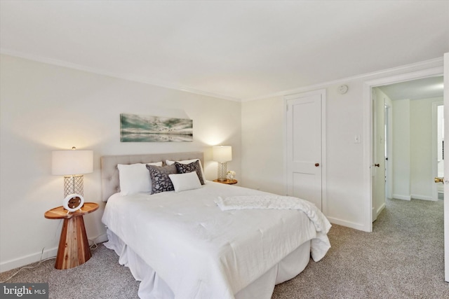 bedroom featuring ornamental molding and carpet floors