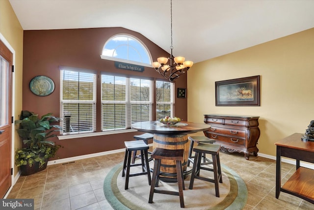 tiled dining room with lofted ceiling and a chandelier