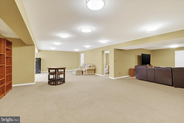 living area with light carpet