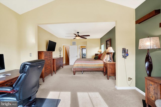 bedroom featuring ceiling fan, lofted ceiling, and light carpet