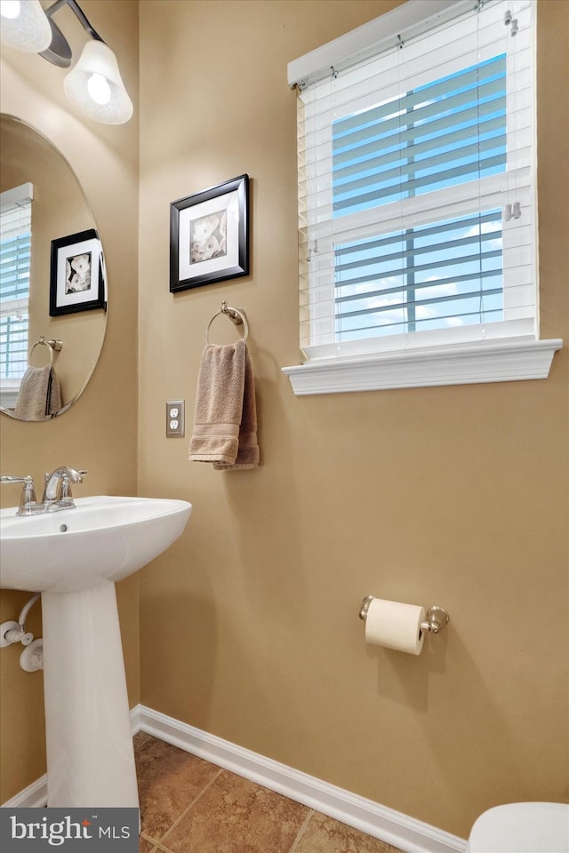 bathroom with tile patterned floors and sink