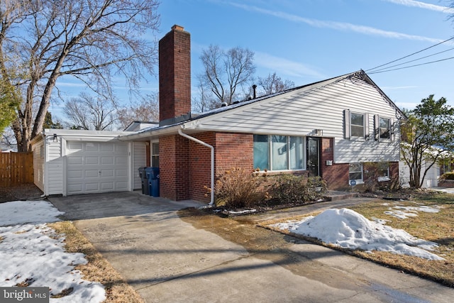 split level home featuring a garage