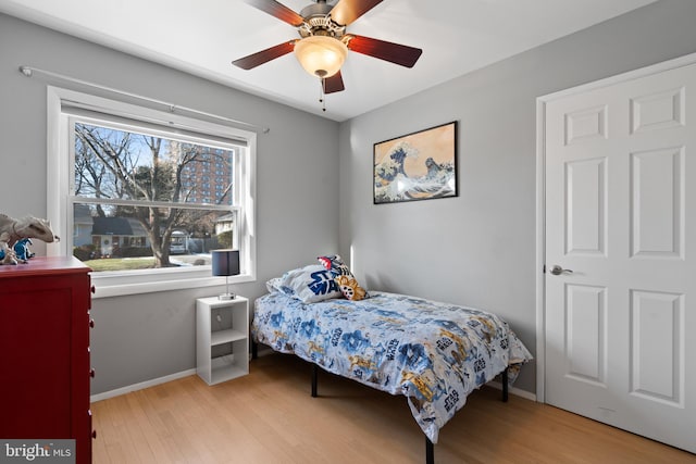 bedroom featuring ceiling fan and light wood-type flooring