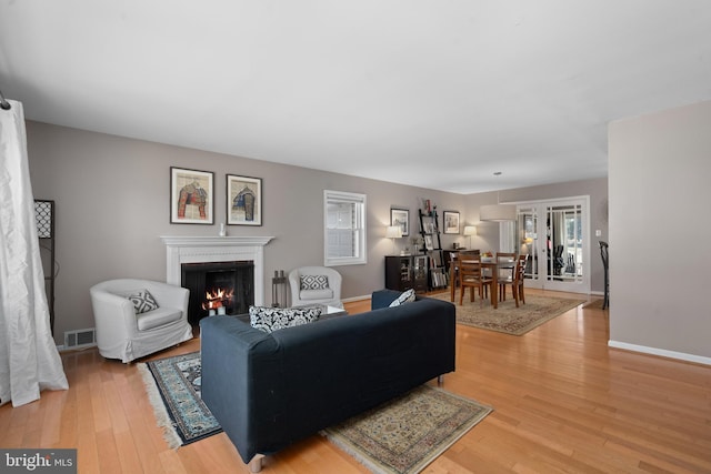 living room with light hardwood / wood-style floors