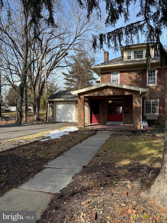 view of front facade with a garage and covered porch