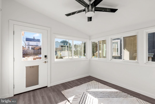 unfurnished sunroom with vaulted ceiling and ceiling fan