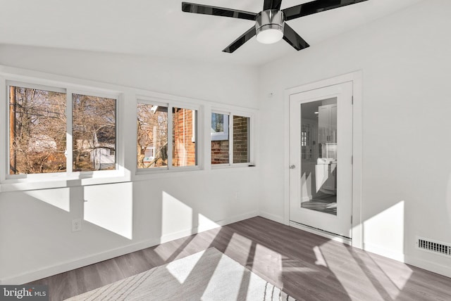 interior space with vaulted ceiling and ceiling fan