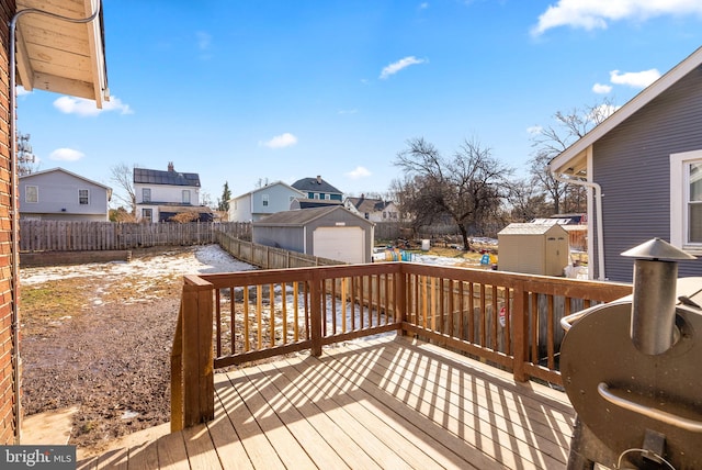 deck featuring a shed and a garage