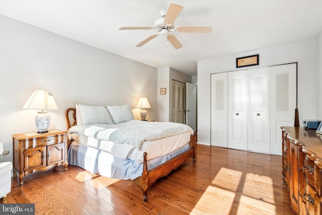 bedroom with ceiling fan and light hardwood / wood-style flooring