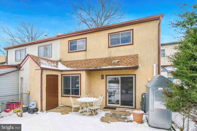 view of snow covered house