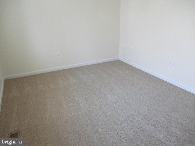 unfurnished room featuring carpet flooring