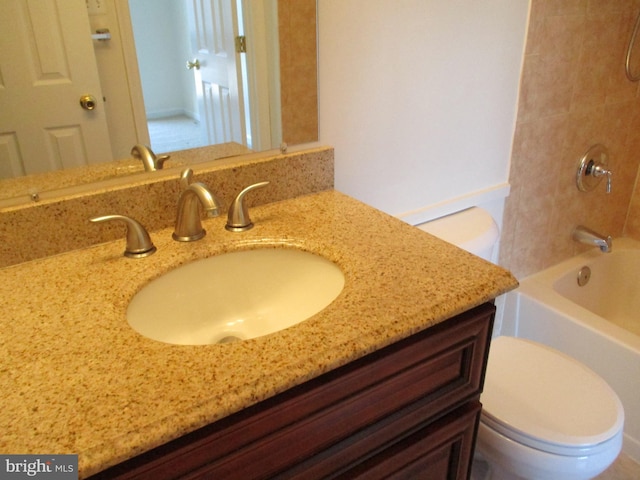 full bathroom featuring vanity, shower / tub combination, and toilet