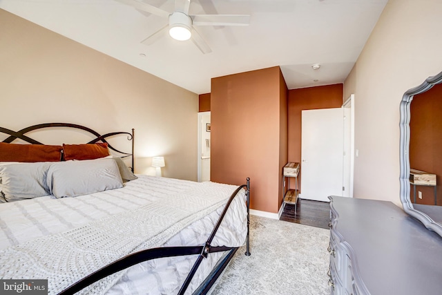 bedroom with ceiling fan and baseboards