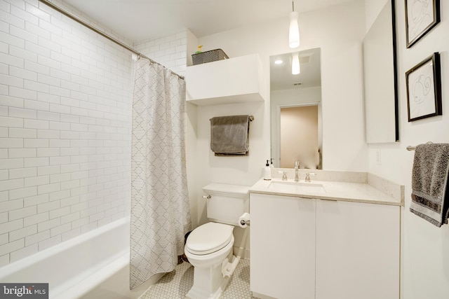 full bath with tile patterned floors, vanity, toilet, and shower / bath combo with shower curtain