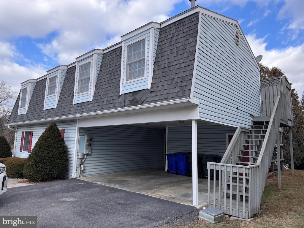 view of home's exterior featuring a carport