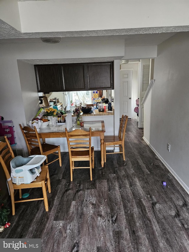 dining room featuring dark hardwood / wood-style floors