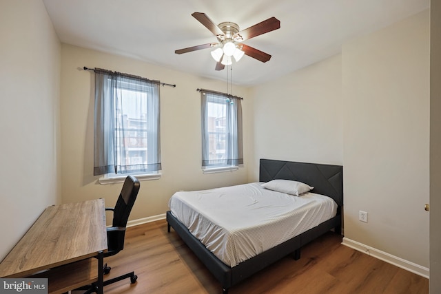 bedroom featuring wood-type flooring and ceiling fan