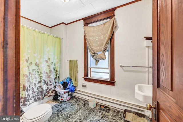 bathroom featuring crown molding and toilet