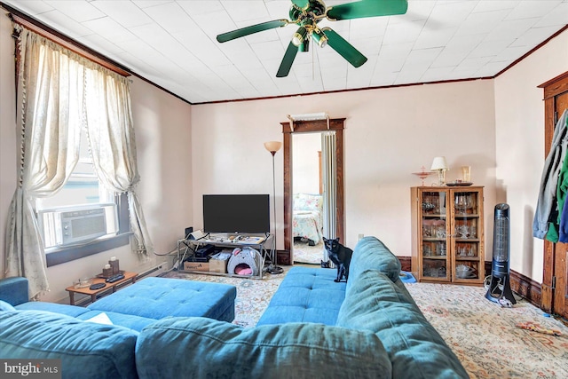 living room with cooling unit, ceiling fan, a healthy amount of sunlight, and crown molding