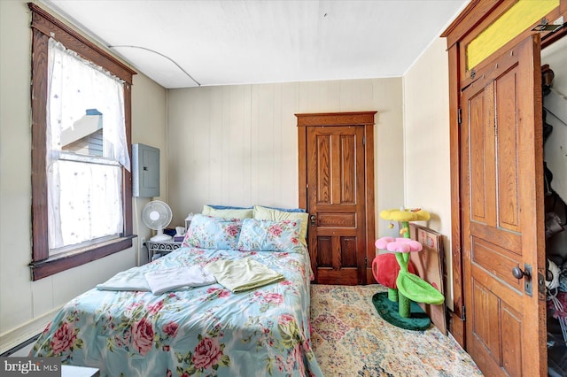 bedroom featuring electric panel