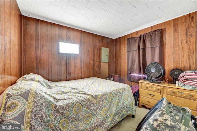 bedroom with wooden walls and carpet floors