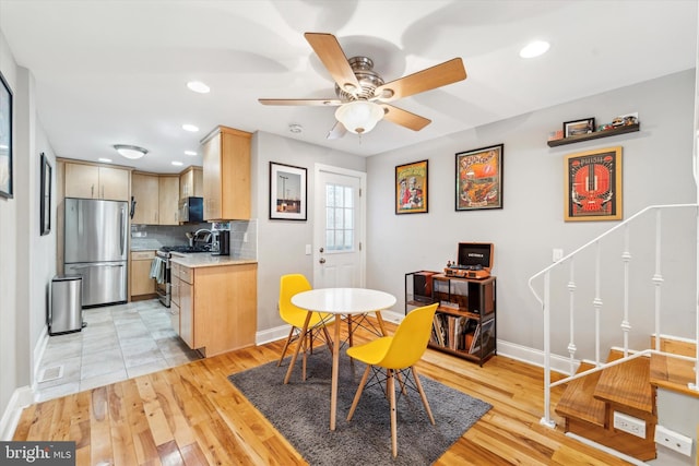 dining area featuring light hardwood / wood-style flooring and ceiling fan