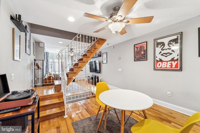 interior space with hardwood / wood-style floors and ceiling fan