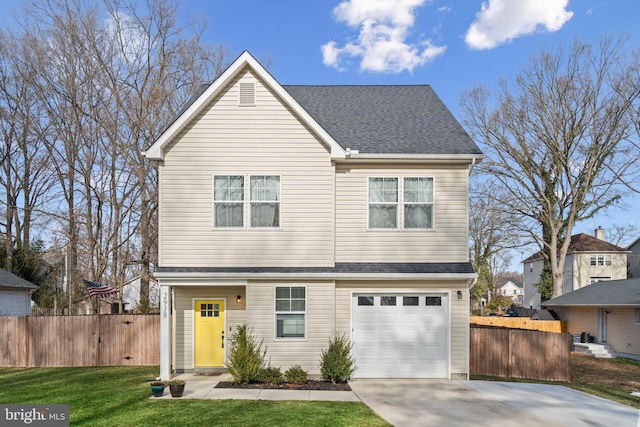 view of front property with a garage and a front yard