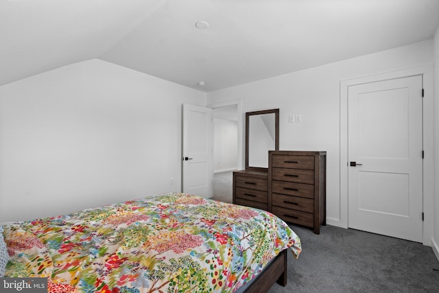 carpeted bedroom featuring lofted ceiling